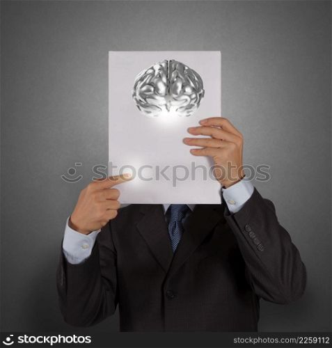 businessman hand show book of 3d metal brain as concept
