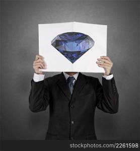 businessman hand show diamond cover book of success business as concept