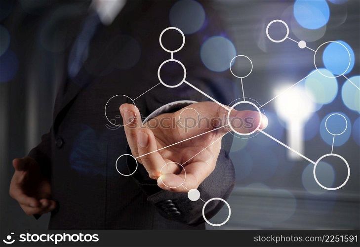 businessman hand showing  blank flow chart on new modern computer as concept with bokeh exposure