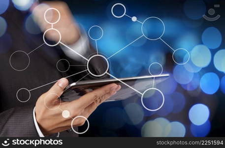 businessman hand showing  blank flow chart on new modern computer as concept with bokeh exposure