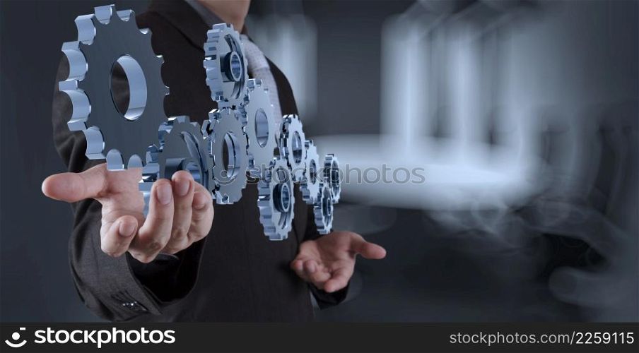 businessman hand showing gear to success concept as concept