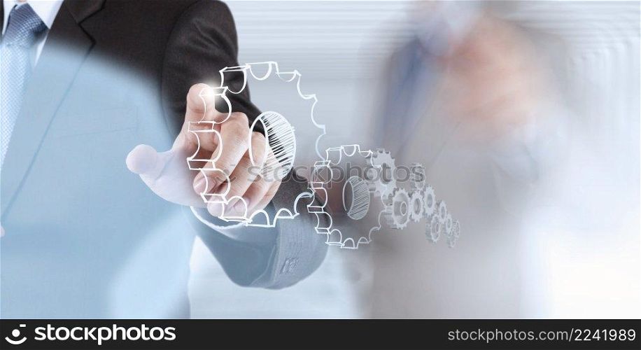 businessman hand showing gears cogs to success concept
