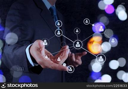 businessman hand showing human icon flow chart on new modern computer as concept with bokeh exposure