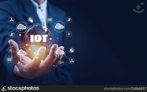 Businessman hand shows a block diagram of internet of things . New Technologies and Business Process Strategies, Operations Automation, Customer Service Management, Cloud Computing.