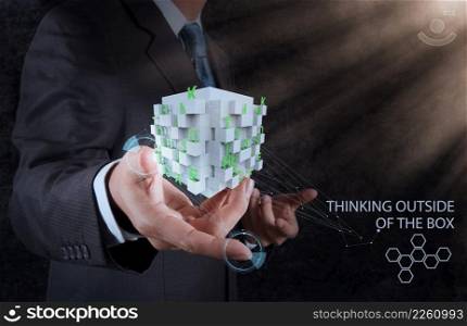 businessman hand shows word thinking outside the box as concept