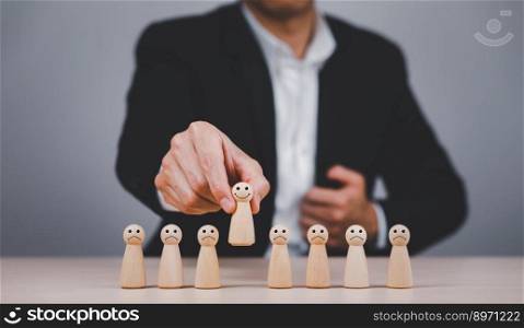 Businessman hand touch wooden Human resources officer looking for leader and CEO concept, Leader leave his comfort zone and get out of the crowd. Personal development, motivation and challenge. 
