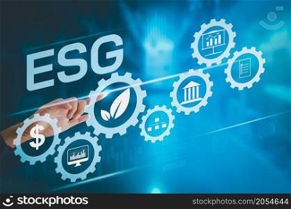 businessman hand touching a virtual screen, business icon. ESG Environment, Society and Governance Organization and personnel development in the company