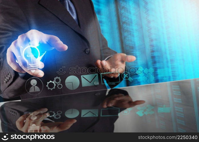 businessman hand touching creative business strategy with light bulb as concept 