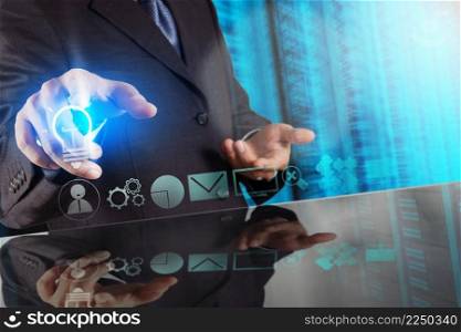 businessman hand touching creative business strategy with light bulb as concept 