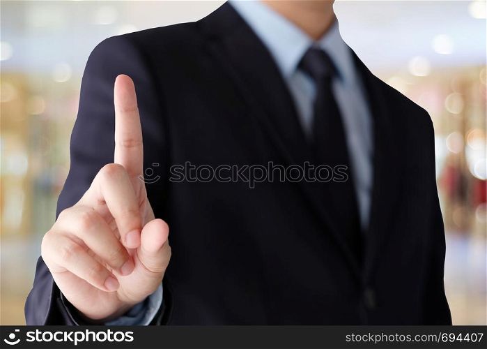 Businessman hand touching over blur office background, business background, banner