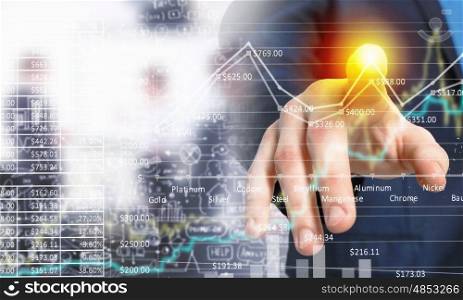 Businessman hand touching virtual graph on media screen. Business and finance