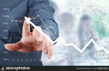 Businessman hand touching virtual graph on media screen. Business and finance