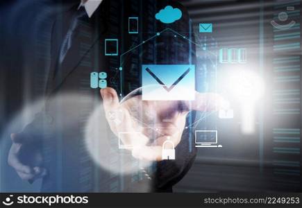 businessman hand use interactive computer with virtual email icon as concept