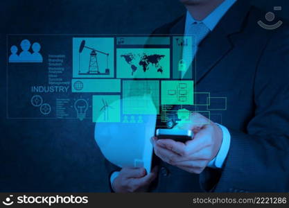 businessman hand use smart phone computer with virtual computer as industry concept