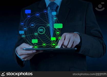 businessman hand use tablet computer with email icon as concept