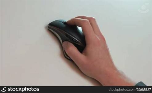 businessman hand using a mouse on desk