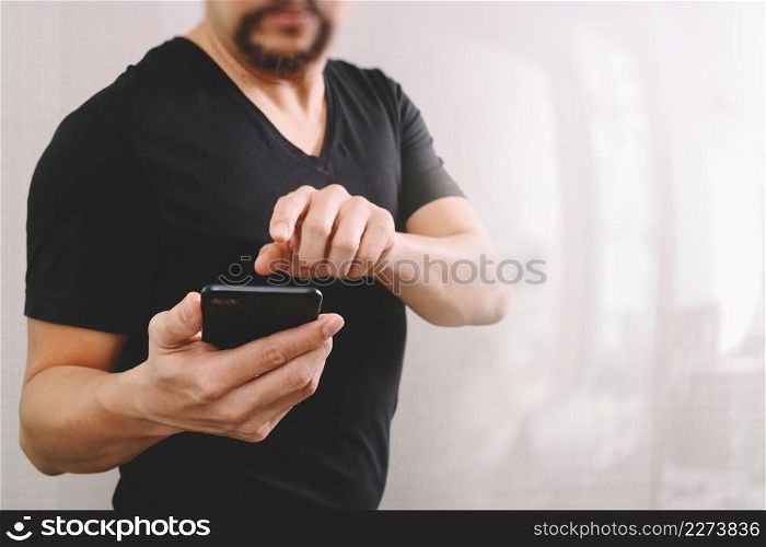Businessman hand using smart phone for mobile payments online shopping,omni channel,on white background