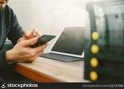 businessman hand using smart phone,mobile payments online shopping,omni channel,digital tablet docking keyboard computer,compact server on wooden desk,filter