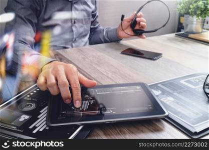 Businessman hand using VOIP headset with digital tablet computer,document,concept communication, it support, call center and customer service help desk,filter effect