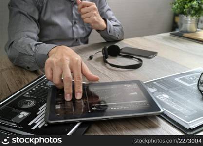 Businessman hand using VOIP headset with digital tablet computer,document,concept communication, it support, call center and customer service help desk 