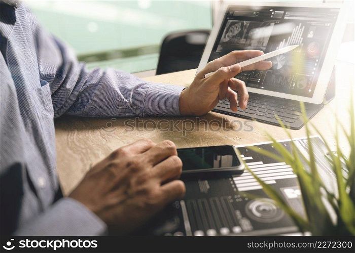 Businessman hand working concept. Documents finance graphic chart. Digital tablet keyboard dock screen computer design smart phone using. Eyeglass on marble desk. Sun flare effect
