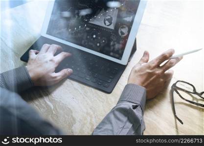 Businessman hand working concept. Photo investor working with new startup project. Digital tablet keyboard dock screen computer design smart phone using. Eyeglass on marble desk. Sun flare effect