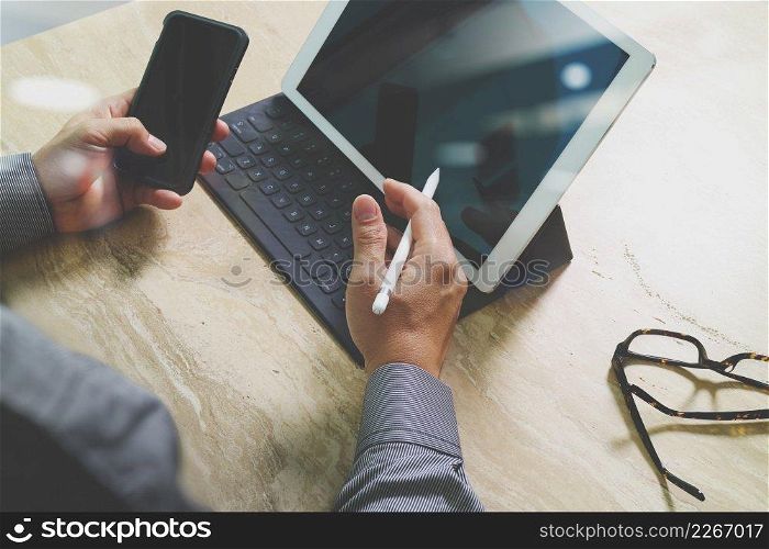 Businessman hand working concept. Photo professional investor working with new startup project. Finance managers meeting.Digital tablet dock screen computer design smart phone using. Sun beams effect  