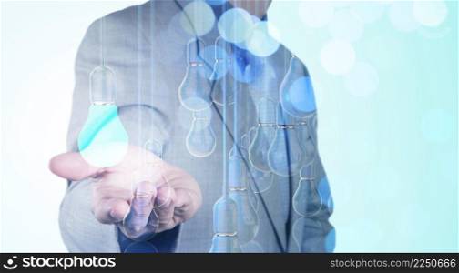 Businessman hand working with 3d light bulb of leadership concept and bokeh exposure