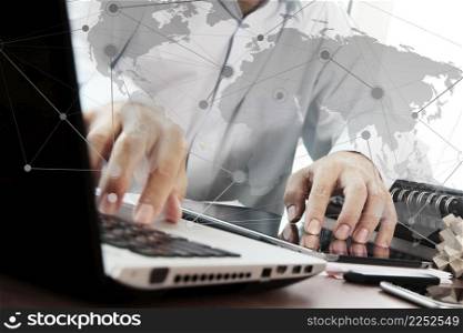 businessman hand working with digital tablet and laptop and social network media diagram on wooden desk in office