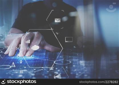 businessman hand working with modern computer in modern office with virtual icon diagram