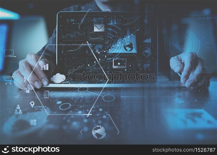 businessman hand working with modern laptop computer in modern office with virtual icon diagram