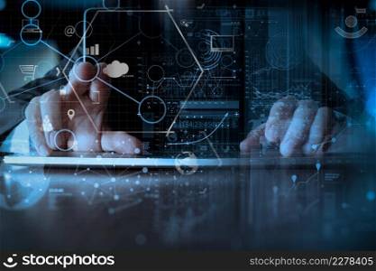 businessman hand working with modern laptop computer in modern office with virtual icon diagram