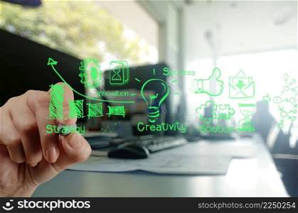 businessman hand working with new modern computer and business strategy as concept 