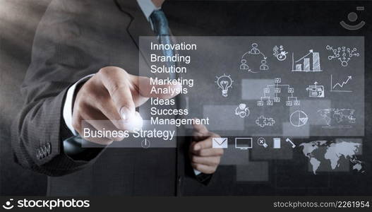 businessman hand working with new modern computer and business strategy as concept