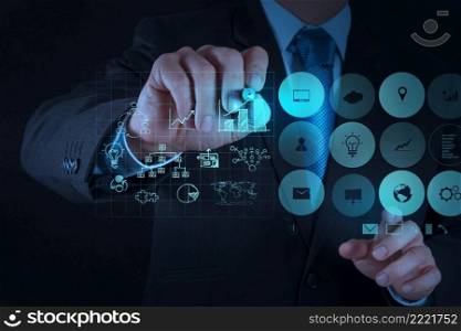 businessman hand working with new modern computer and business strategyand success as concept