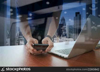 businessman hand working with new modern computer and smart phone and business strategy on wooden desk as concept  