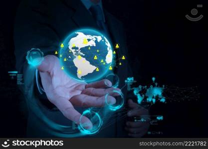 businessman hand working with new modern computer show the earth social network structure as concept