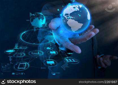 businessman hand working with new modern computer show the earth social network structure as concept