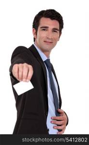 Businessman handing his business card.