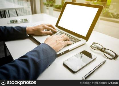 businessman hands working with digital tablet computer and smart phone with business graph on desk as concept.