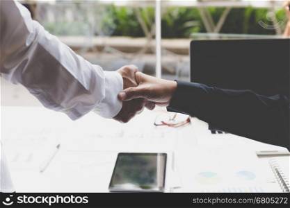 businessman handshaking in office - teamwork, cooperation, agreement, acquisition concept