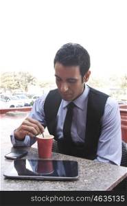 Businessman having coffee , INDIA , DELHI