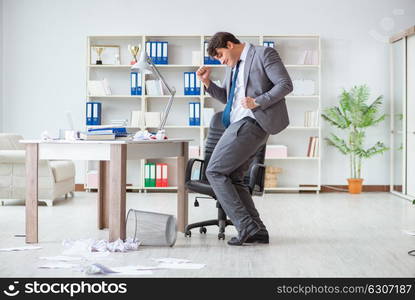 Businessman having fun taking a break in the office at work