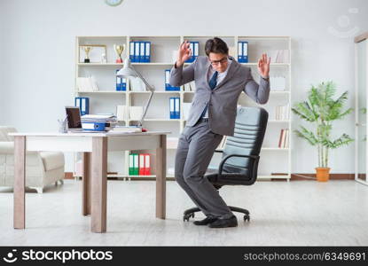 Businessman having fun taking a break in the office at work