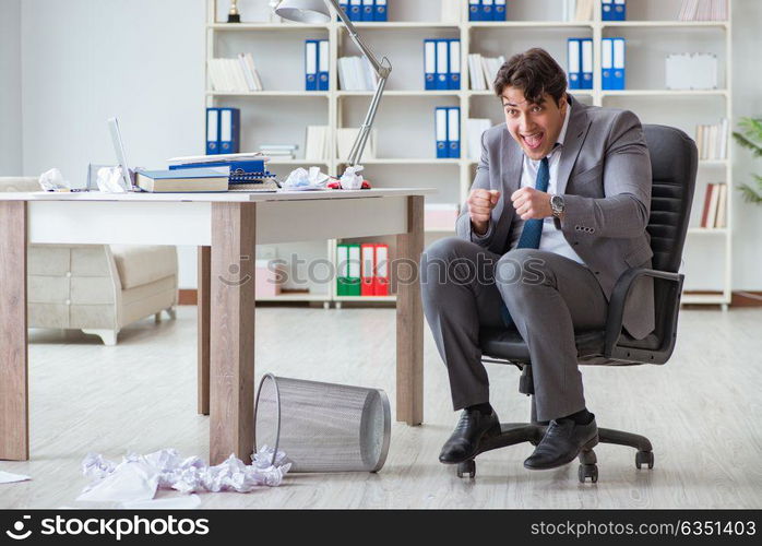 Businessman having fun taking a break in the office at work