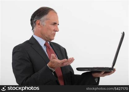 Businessman having technical issues
