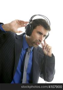 Businessman hearing and singing music with headphones, take a break