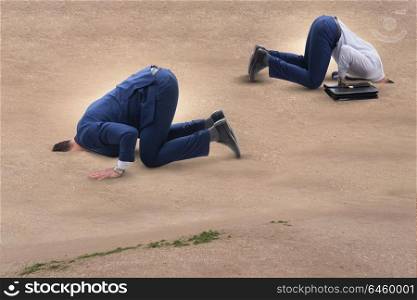 Businessman hiding his head in sand escaping from problems