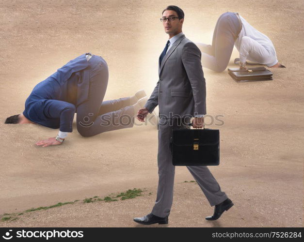 Businessman hiding his head in sand escaping from problems. The businessman hiding his head in sand escaping from problems