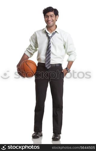 Businessman holding a basketball